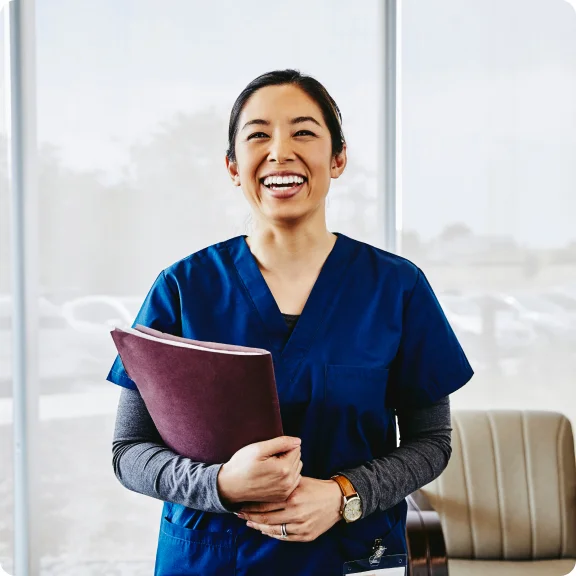 A woman was holding educational resources.