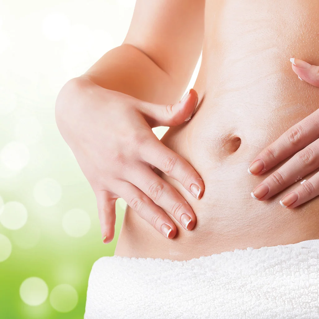 a woman touching her stomach